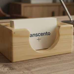 Handcrafted light wood business card holder on a wooden desk.