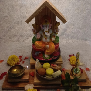 Handcrafted light pine wood mini temple featuring a tiered roof design and a built-in side stand for incense or small idols.